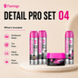 Flamingo Detail Pro Set 04 car care products displayed on a beige background with a white pedestal. The set includes three silver spray cans with bright pink caps (Dashboard Polish, Tire Foam, Foam Cleaner, polish car wax) and one matching pink-liddled jar of clay clay remover, alongside a 'What's Included' list on the left.